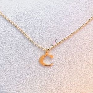 Lower case “c” necklace